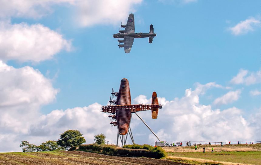 BBMF Lancaster PA474 flies past the newly installed Bomber County Gateway Lancaster sculpture On Freedoms Wings on 11th September 2025. Photo Claire Hartley