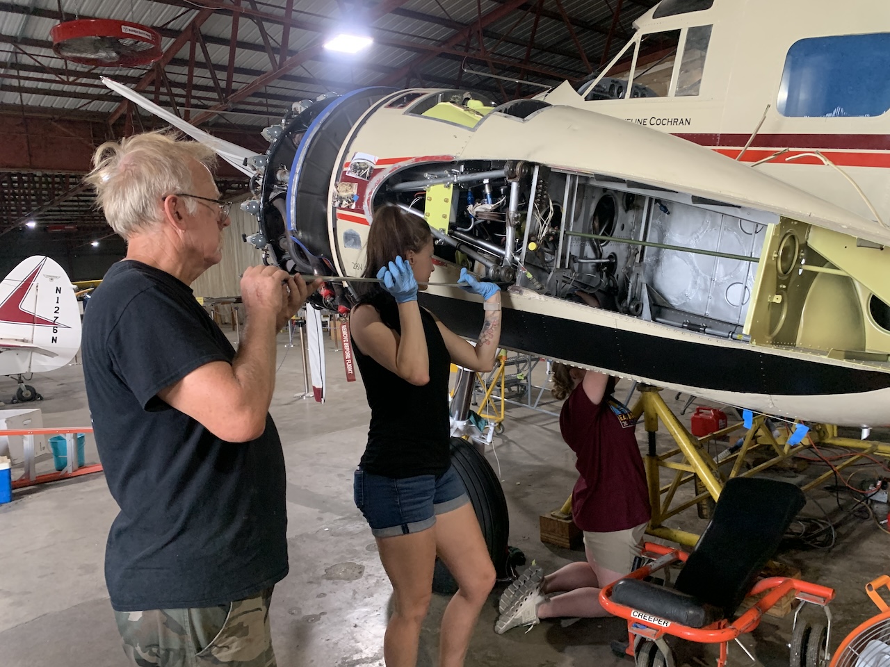 Bill Cyntia and Sharlais installing wing spar straps