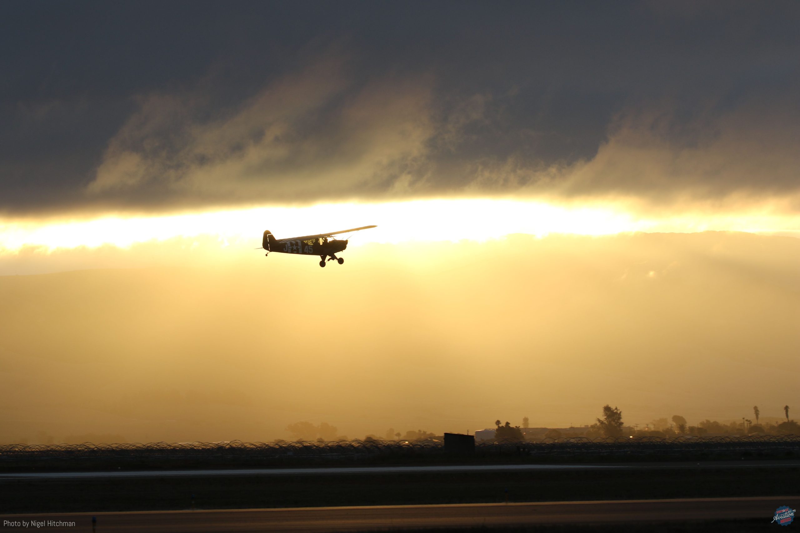 Cal Aerofab Flight Academy s Piper L 4 heads out with a passenger for an evening ride after the show scaled