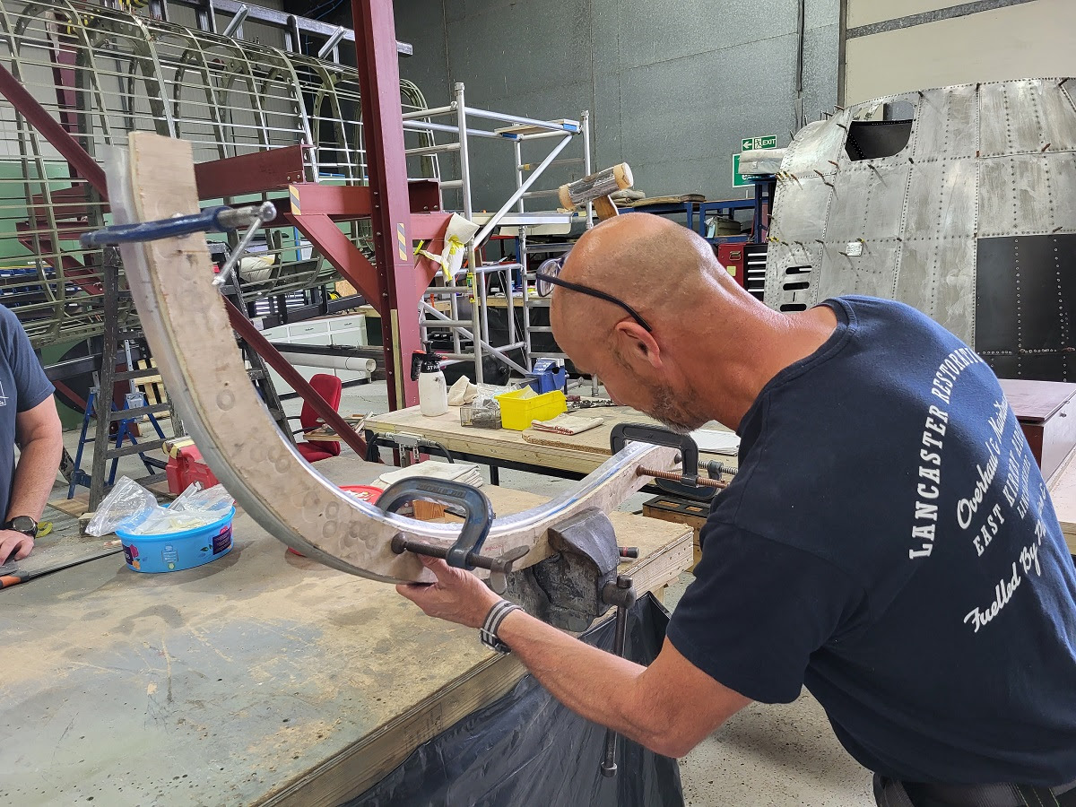 Chris forming the new frame former for the nose of NX611