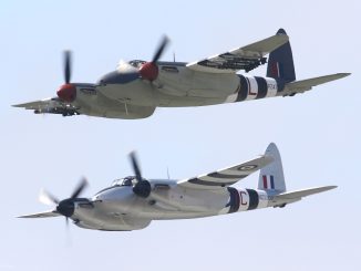 Close up of Mosquitoes PZ474 top and NZ2308 bottom flying in a formation pass. The Mosquitos were flown by Bernie Vasquez and Steve Hinton Sr