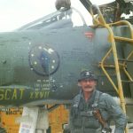 Col. Robin Olds poses with his F-4 Phantom II "Scat XXVII" at Ubon Royal Thai Air Force Base, Thailand. Olds had named his P-38s and P-51s in WWII "Scat" and carried this tradition into Vietnam. (U.S. Air Force Photo)