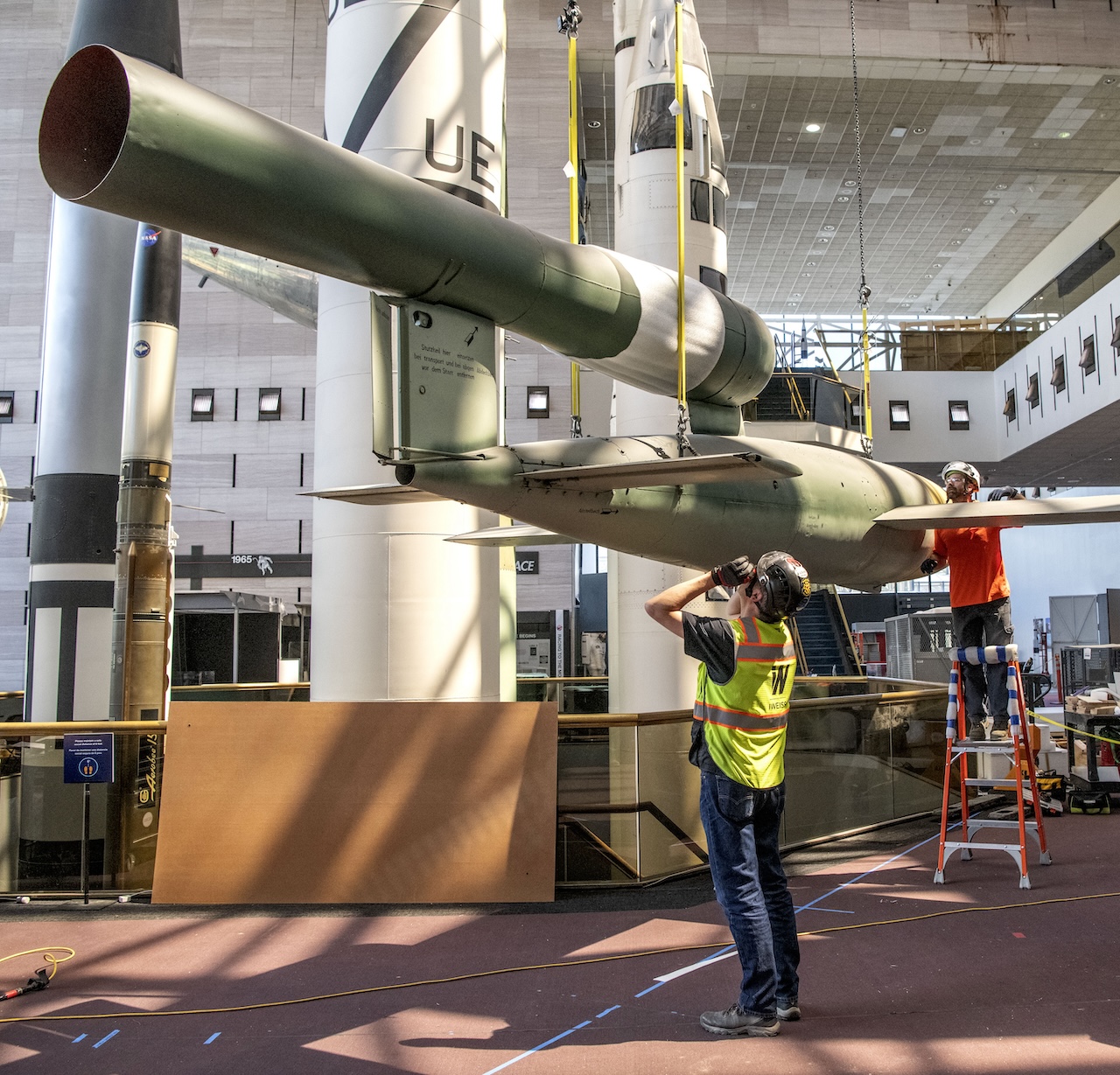 Contractors and staff lower the V 1 Cruise Missile in the Space Race gallery at Space Museum in Washington DC April 12 2022. Smithsonian photo by Jim Preston