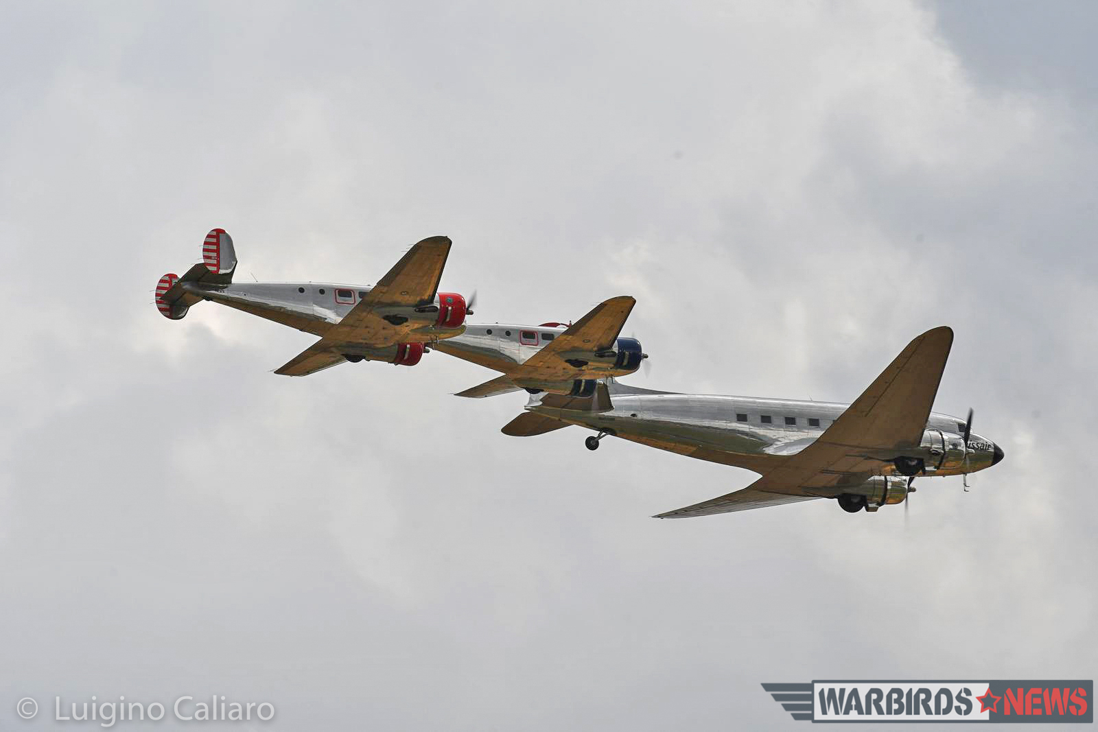 The Swissair DC-3 flies in tight formation with a pair of similarly-polished Beech Model 18s. (photo by Luigino Caliaro)