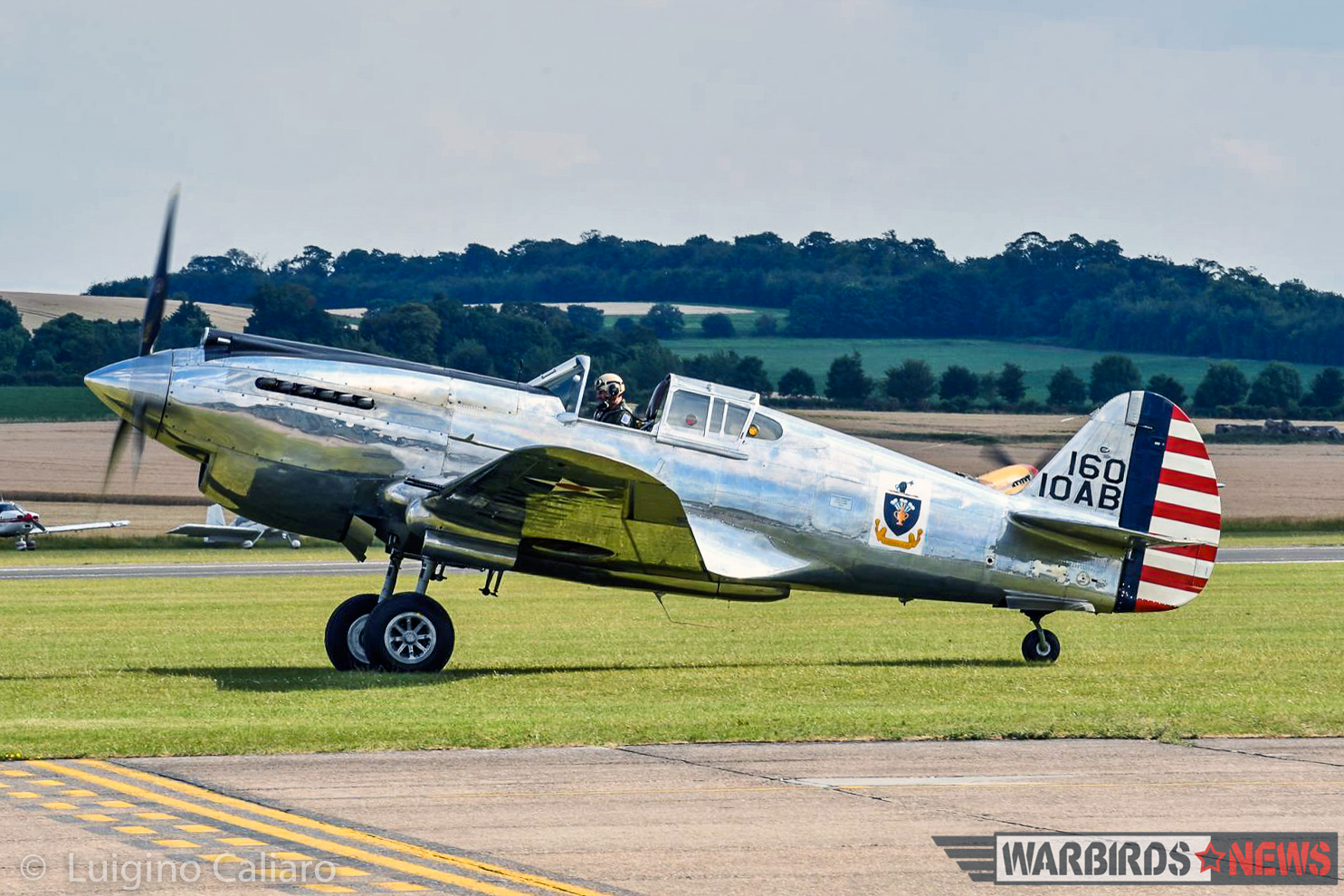 The Fighter Collection's dazzling P-40C 41-13357 taxies out for takeoff. (photo by Luigino Caliaro)