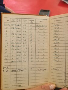 Dick Miralles log book showing his last flight in the SBD in 43 and his flight Saturday on the same page. Photo Angela Decker