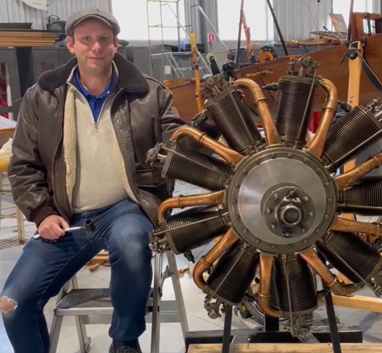 Director of Maintenence Mark Mondello with a Le Rhone rotary engine at the museum. Photo via Old Rhinebeck Airdrome