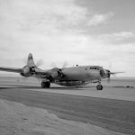 A B-29 Mothership with X-1B attached taxis in off of the lakebed.