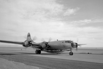 A B-29 Mothership with X-1B attached taxis in off of the lakebed.