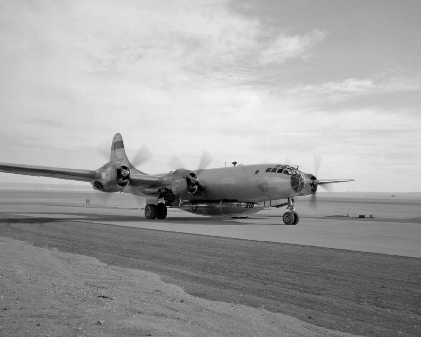 A B-29 Mothership with X-1B attached taxis in off of the lakebed.