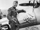 Edward V. Rickenbacker stands next to his Nieuport 28 in a field near Toul France. National Archives