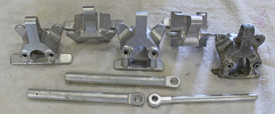 The newly manufactured up-lock forgings and rods. The original, corroded example can be seen on the extreme right. (photo via Tom Reilly)