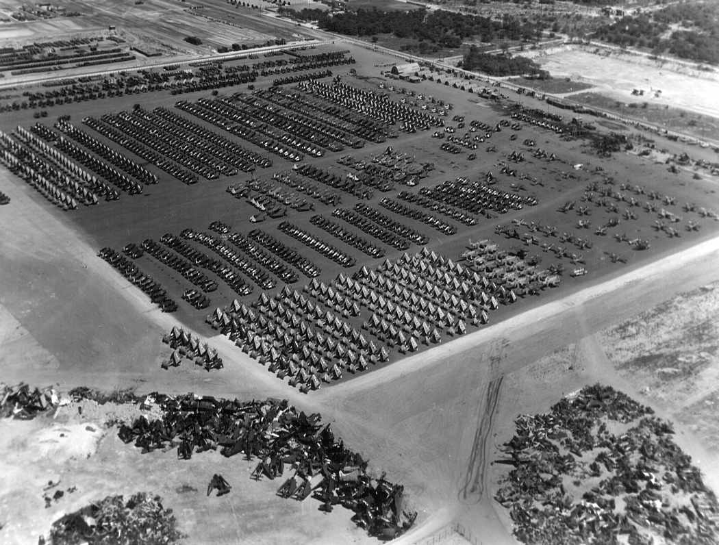 Oct. 1945: A month after Japan's unconditional surrender, the ramps at Ewa being used to inventory and deactivate hundreds of USN and USMC aircraft. Awaiting their fate are Corsairs, Wildcats, Hellcats, Avengers, Helldivers, and various other combat aircraft. The cluster of aircraft in the foreground are Avenger torpedo-bombers, already beginning the scrapping process.