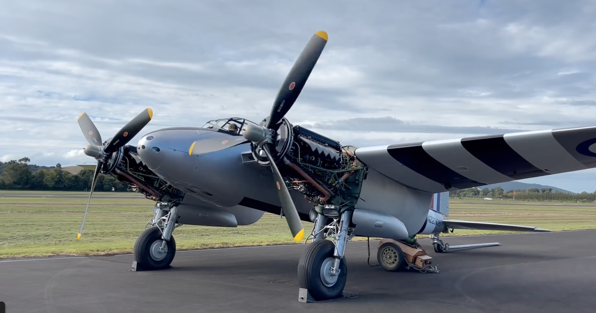 DH Mosquito T.43 NZ2308/ZK-PWL about to start its two Rolls-Royce Merlins for the first time in nearly 70 years. [Screenshot from Avspecs Ltd video on Facebook]