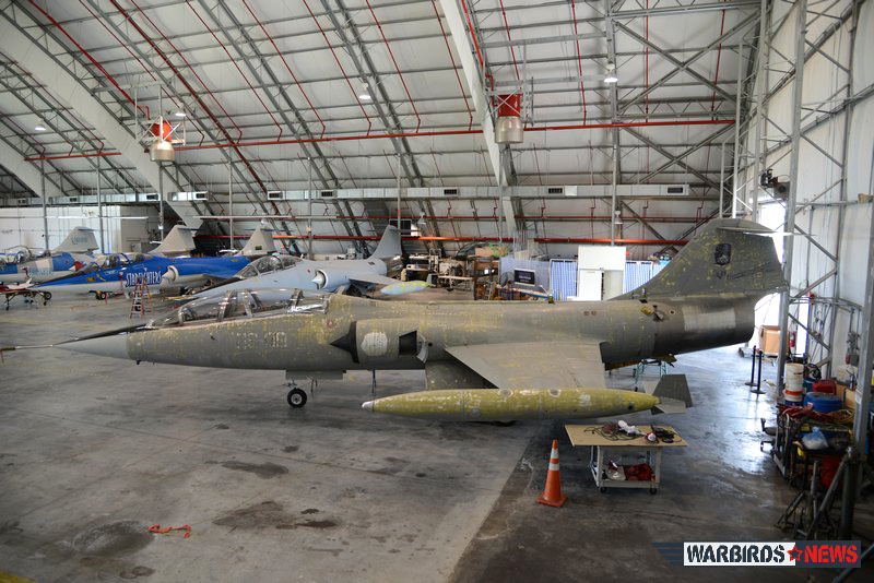 A view of the hangar with he former Italian Air Force TF-104 in the foreground. Notice the markings of the 4 Stormo still visible. ( Image by Luigino Caliaro)