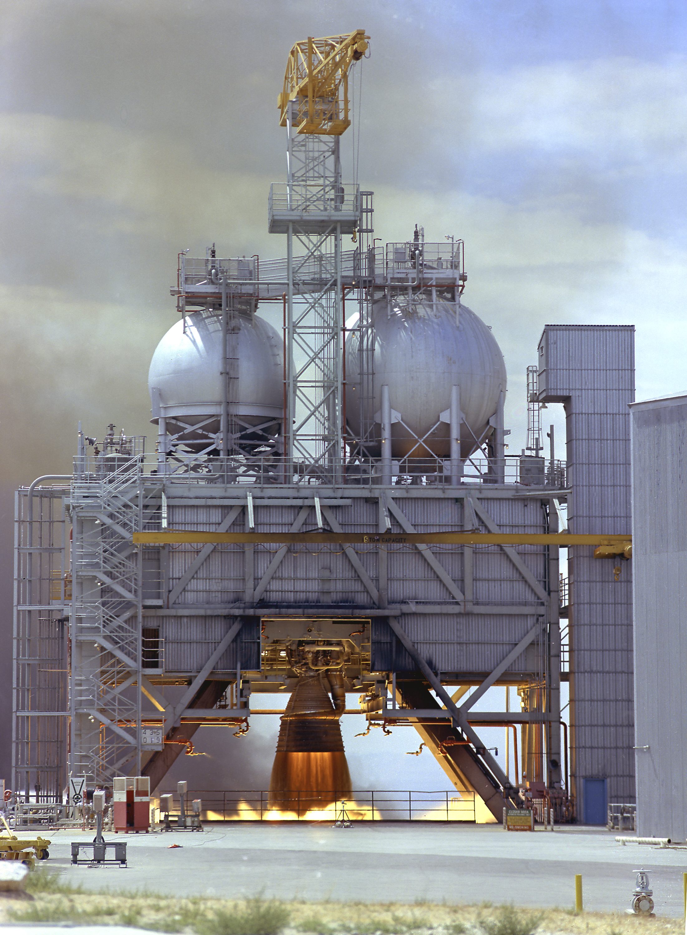 Test Firing of an F-1 Engine at Edwards Air Force Base in 1960. The F-1 engine was developed and built by Rocketdyne under the direction of the Marshall Space Flight Center. It measured 19 feet tall by 12.5 feet at the nozzle exit, and produced a 1,500,000-pound thrust using liquid oxygen and kerosene as the propellant. The image shows an F-1 engine being test fired at the Test Stand 1-C at the Edwards Air Force Base in Californoa. Photo via Wikipedia.