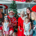 Family with Mr. Mrs. Claus at Christmas in July 2023 1