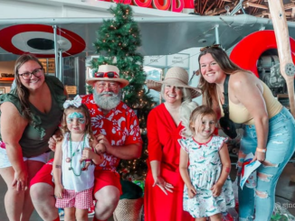 Family with Mr. Mrs. Claus at Christmas in July 2023 1