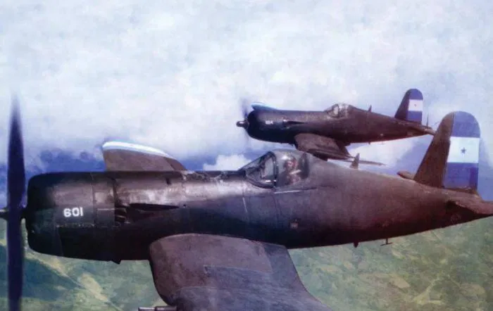 Fuerza Aérea Hondureña F4U 5Ns FAH 601 and FAH 604 airborne some time in the 1960s.