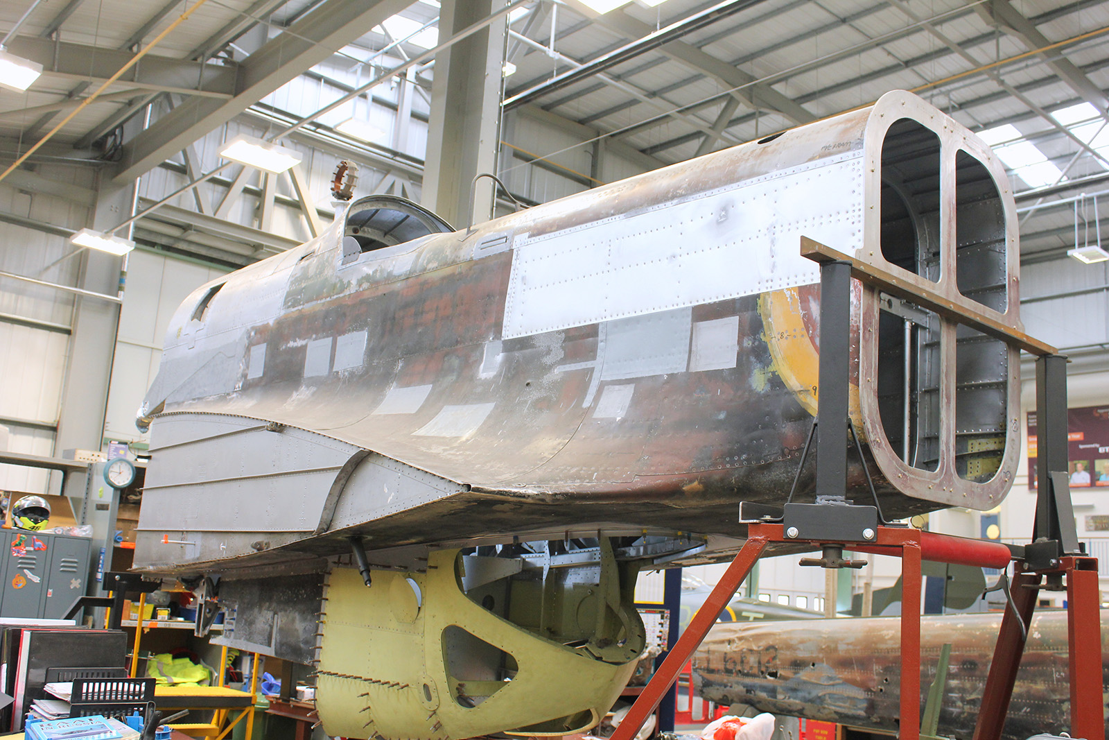 P1344’s rear fuselage section in its jig and almost structurally complete. Notice the tail boom in the background. You can clearly read the serial number L6012 on its side. (photo by Geoff Jones)