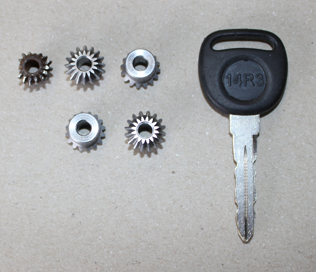 The specialty, miniature 16 tooth gears which Weezie managed to find at a New York supplier which proved invaluable to the overhaul of the CAT units. The truck key is included to show just how tiny these gears are! (photo via Tom Reilly)