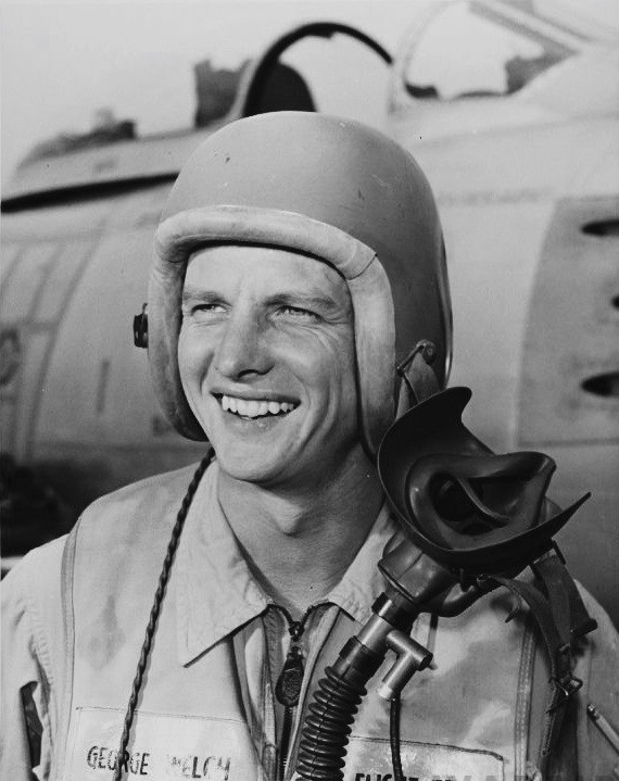 George S. Welch North American Aviation test pilot wearing his orange flight helmet. An F 86 Sabre is in the background. San Diego Air and Space Museum Photo Archives