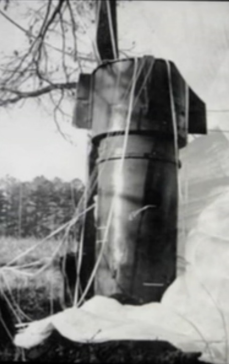 Close up of one of two Mk.39 thermonuclear bombs rests in a field in Faro, NC after falling from a disintegrating B-52 bomber. (image via Wikipedia)