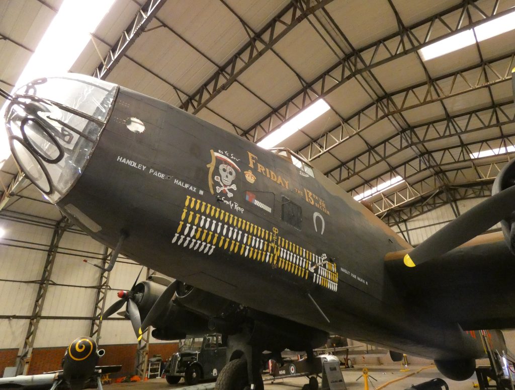 Strongman vs. Bomber – Who Will Win? 11 Handley Page Halifax MkIII bomber ‘Friday the 13th VE Day nose art