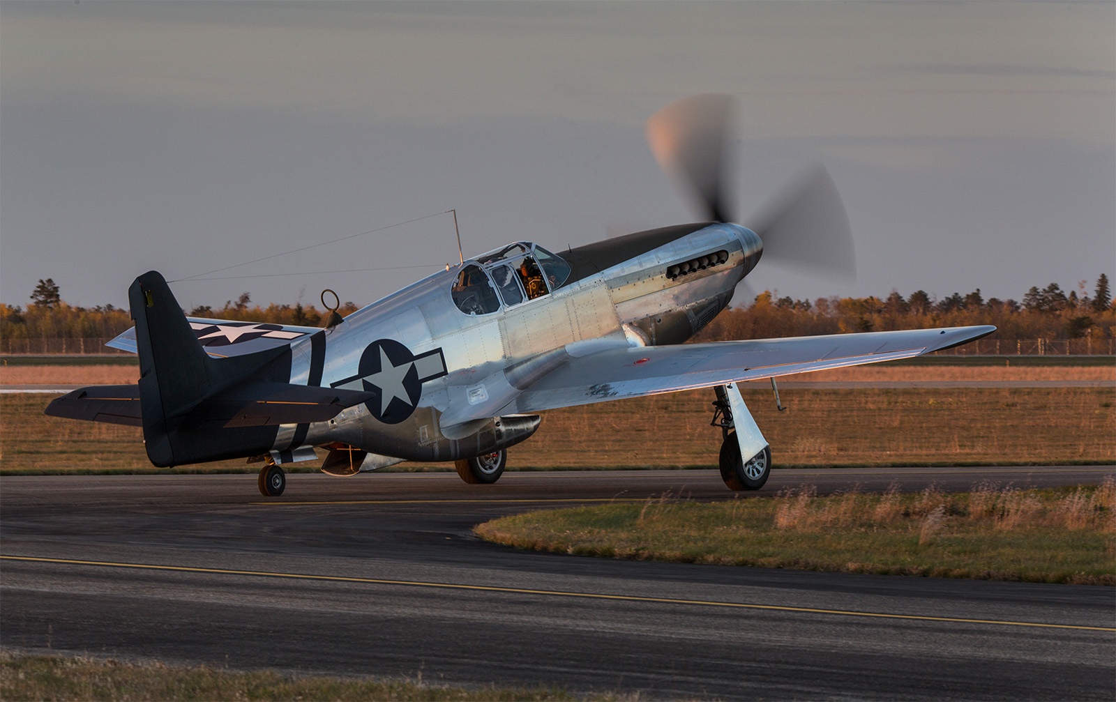 As twilight descended, it was finally time for what everyone at AirCorps Aviation and Texas Flying Legends Museum had been waiting for since restoration began in earnest on October 1st, 2014. It took three years and about two weeks before this P-51C-10NT flew again for the first time. (photo by John LaTourelle via AirCorps Aviation)