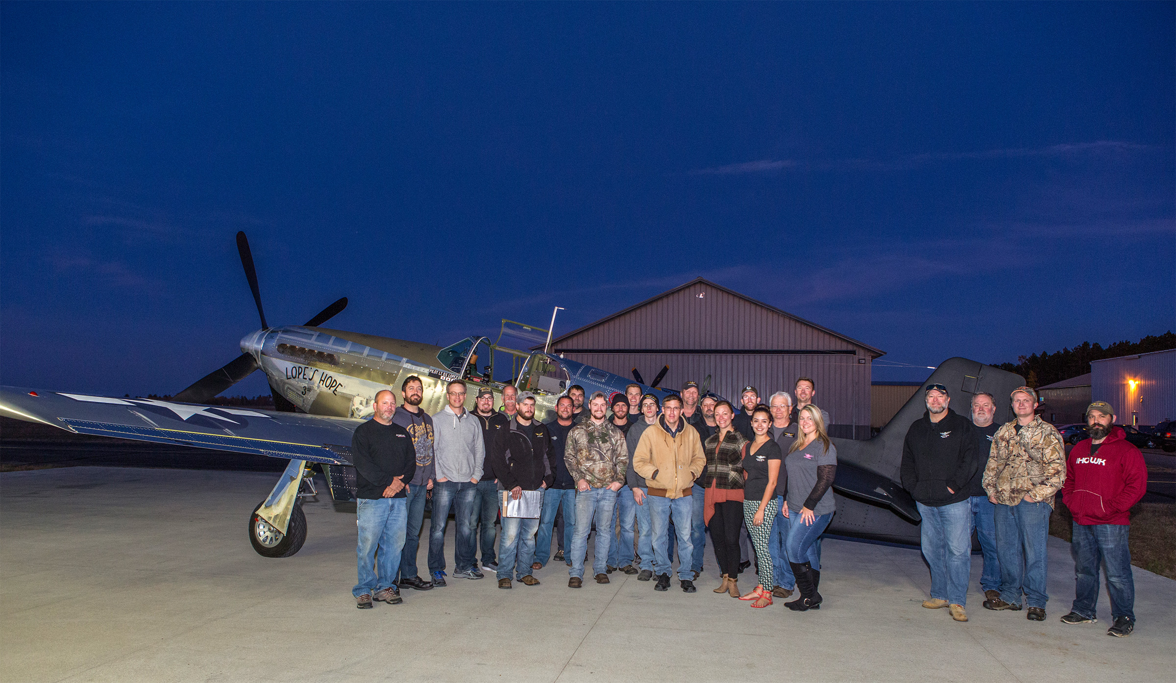 A very pleased AirCorps Aviation crew poses in front of Lope’s Hope 3rd after a squawk-free test flight. (photo by John LaTourelle via AirCorps Aviation)
