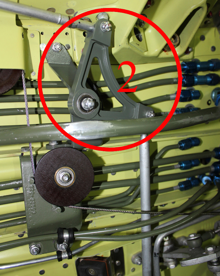 Left-hand 90 degree door uplock bell crank mounted on forward spar. (photo via Tom Reilly)