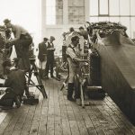 Image Working on airplanes in the original Boeing factory in the 1910s.