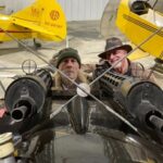 Iron Maiden's Bruce Dickinson in the Old Rhinebeck Fokker Dr.I replica compares notes with ORA pilot Dave King. [Photo via Old Rhinebeck Aerodrome]