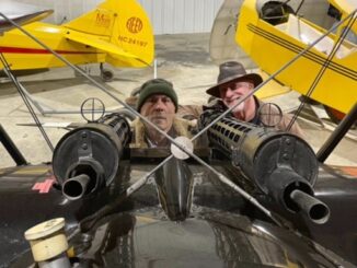 Iron Maiden's Bruce Dickinson in the Old Rhinebeck Fokker Dr.I replica compares notes with ORA pilot Dave King. [Photo via Old Rhinebeck Aerodrome]