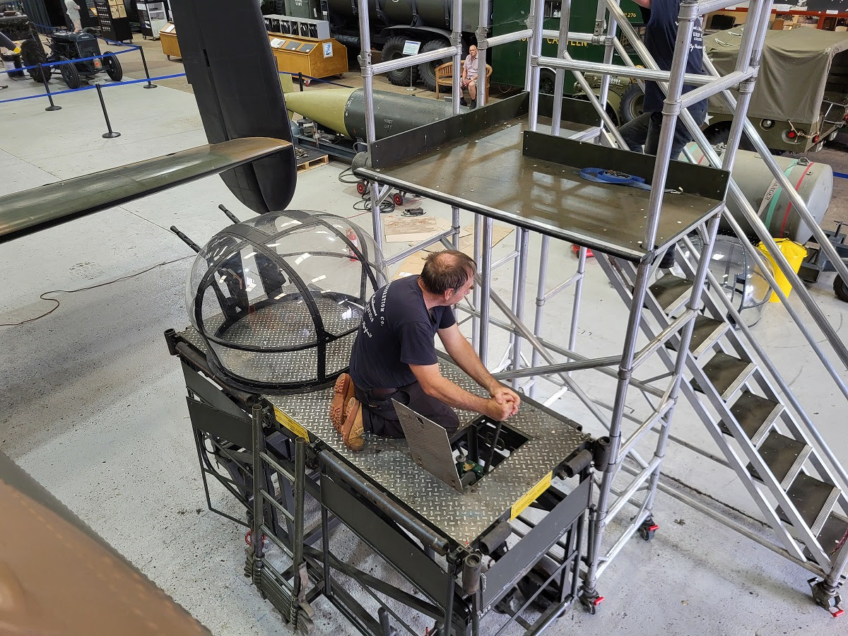 John lifting the replacement mid upper turret cupola into position on NX611