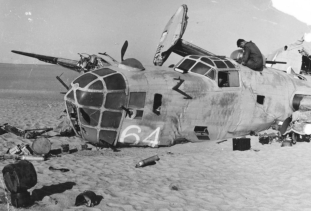 Nose view of Consolidated B-24D Lady Be Good crash site. The plane made a surprisingly good pilotless belly landing and skidded 700 yards before breaking in half and stopping. (U.S. Air Force photo)
