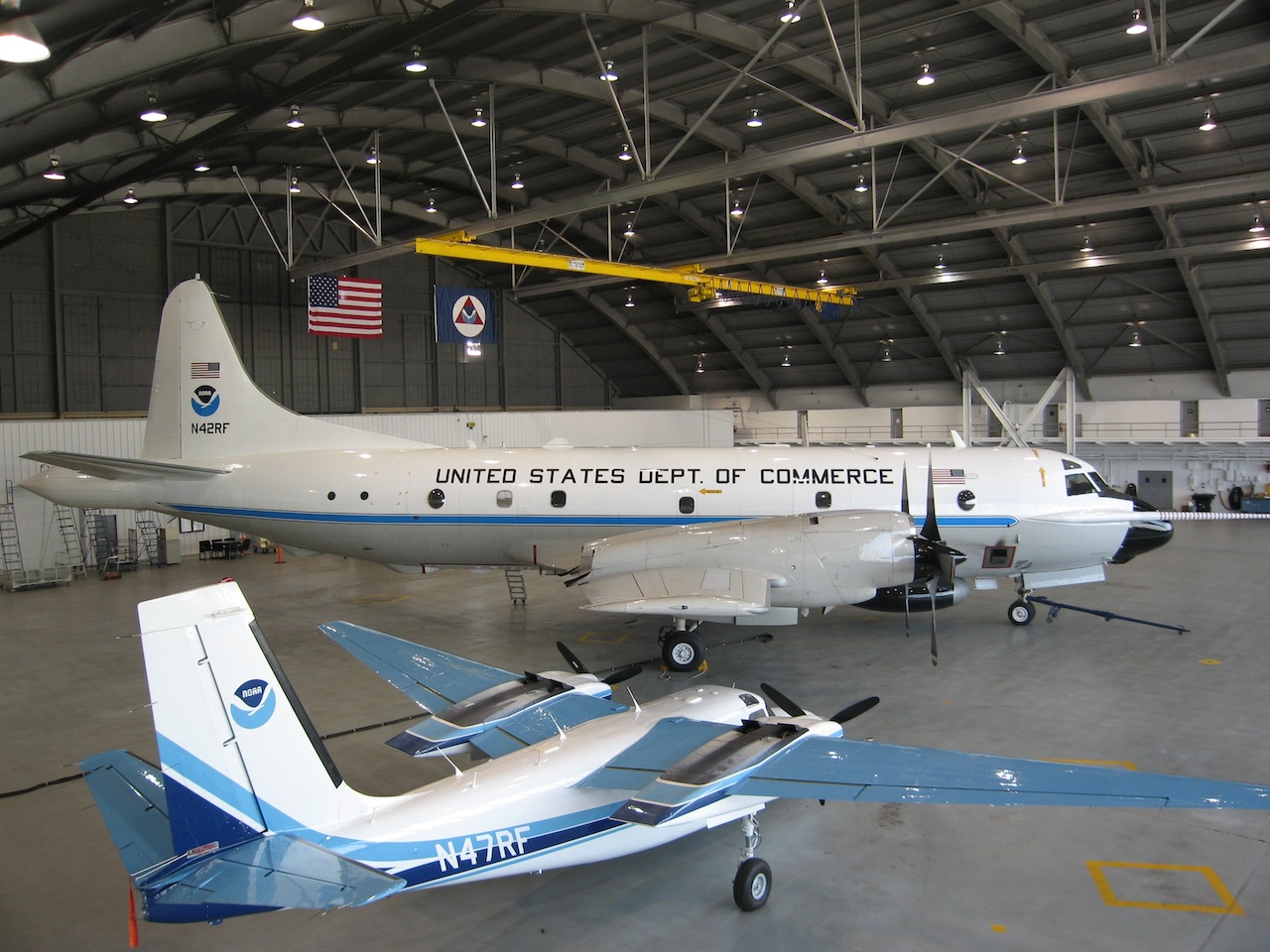 Lockheed WP 3D Orion N42RF and Rockwell Aero Commander AC 500S N47RFin hangar at MacDill Air Force Base