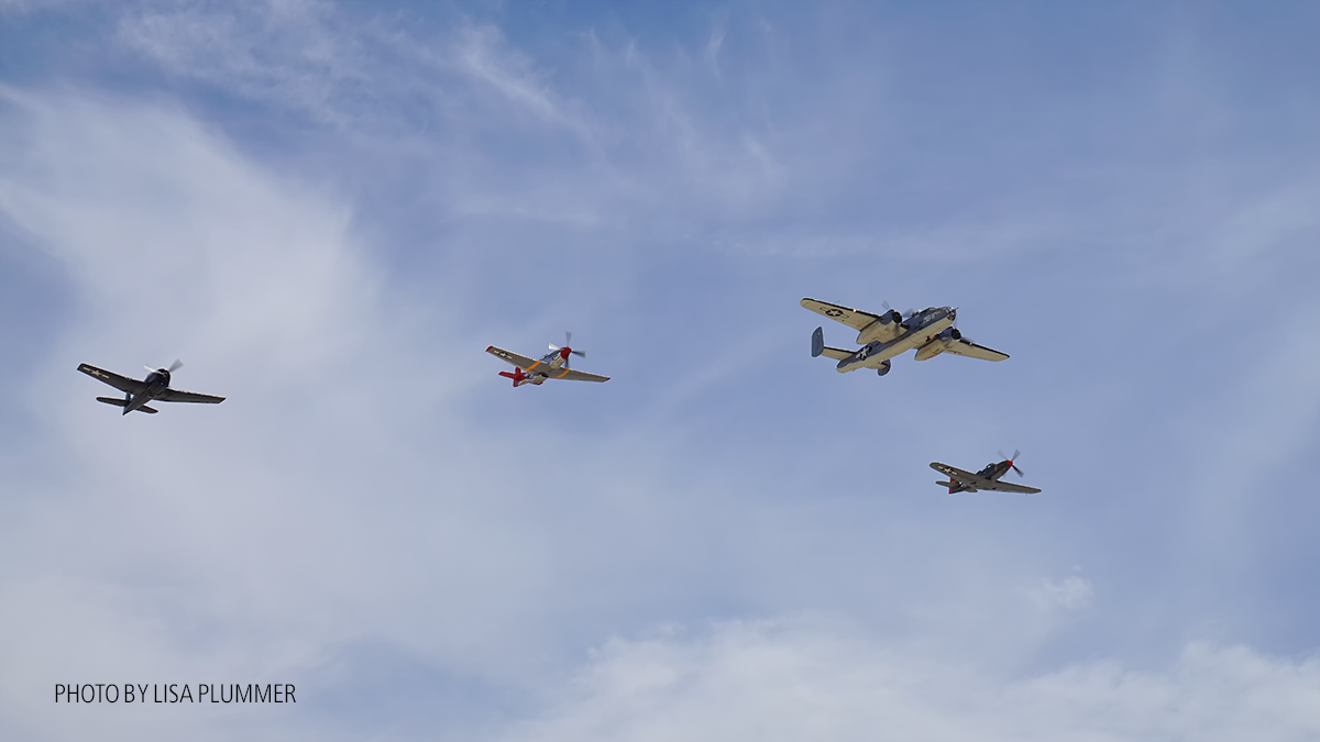 Missing Man formation CAF PBJ in the lead, PSAM P-51right wing, PSAM P63 KingCobra left wing and the CAF F6F Hellcat outer right wing. ( Photo by Lisa Plummer)