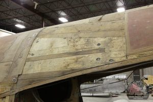 The Mossie's wooden fuselage shows signs of repairs and weather damage. (Image Credit: Calgary Mosquito Society)