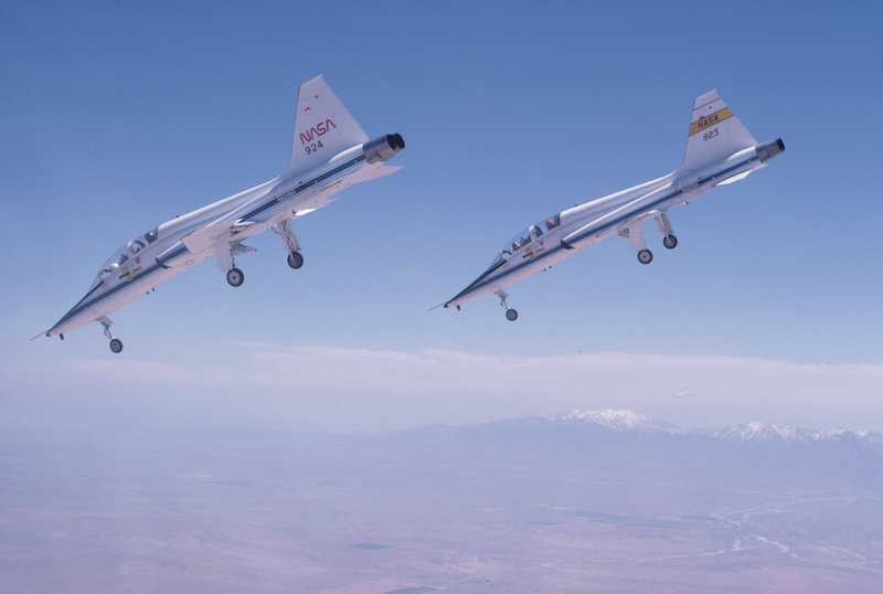 A pair of T-38s dive toward a runway at Edwards Air Force Base in Calif., on a steep approach like the one the shuttle uses on approach. Photo courtesy of Story Musgrave (Photo via NASA)