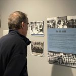 "Camp Boardwalk" WWII Exhibit to Open at NAS Wildwood Aviation Museum 10 NASW Curator Chet Rietheimer viewing Camp Boardwalk while displayed at the Noyes Art Garage in Atlantic City