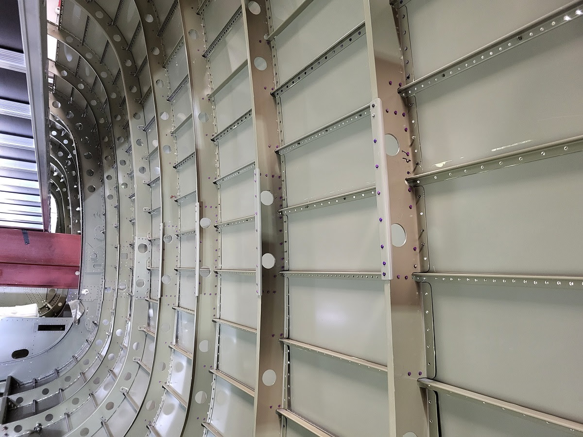 NX611 rear fuselage flying control runs completed ready for the control tubes