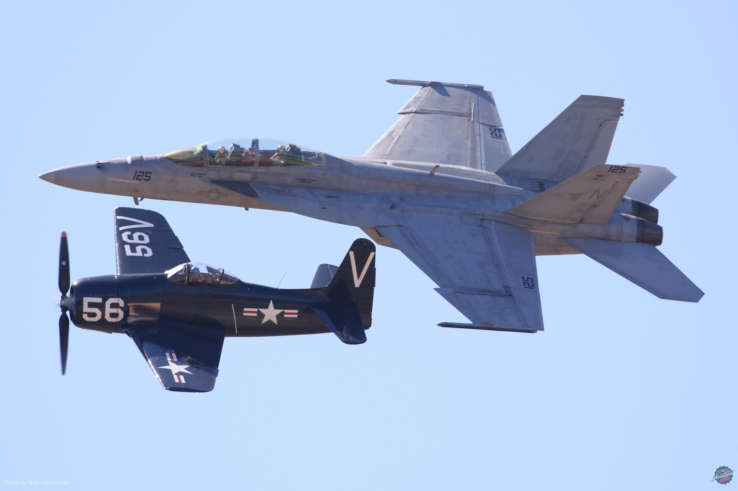 Navy Legacy Flight formation between the Planes of Fame s F8F Bearcat and an F A 18E Super Hornet of Strike Fighter Squadron 122 VFA 122 scaled