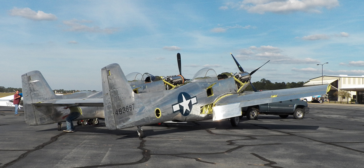 The XP-82 sitting out in the sunshine during her move to the new hangar. (photo via Tom Reilly)