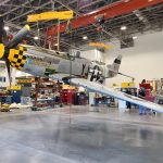 P 51D being lifted in a 22 degree roll in the Engen Restoration Hangar Smithsonian Photo by Richard Snell