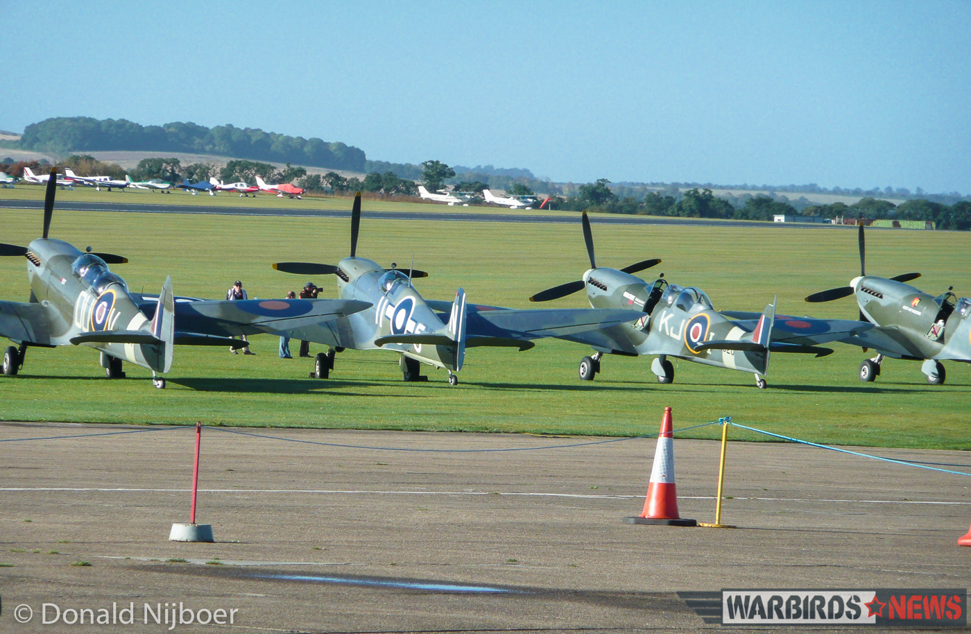 Four of the fourteen Spitfire variants which took part in the massed flypast near the end of the show. Here we see, from the left, a pair of Spitfire Tr.9 two seat trainers flanking a rare Seafire LF.III. Spitfire Mk.IX RR232 'City of Exeter' sits at the far right. (photo by Donald Nijboer)