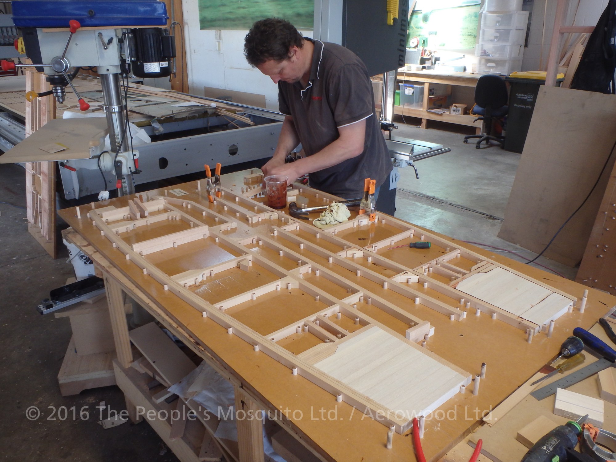 Assembling some of the wing ribs on one of the many different jigs. (photo via The People's Mosquito)