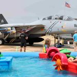 Paddleboats alongside F 14 Tomcat