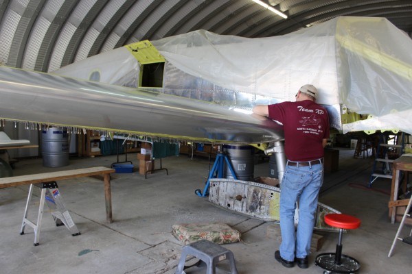 Paul checking the fit of the leading edge skins on the right-hand outer wing panel. (photo via Tom Reilly)