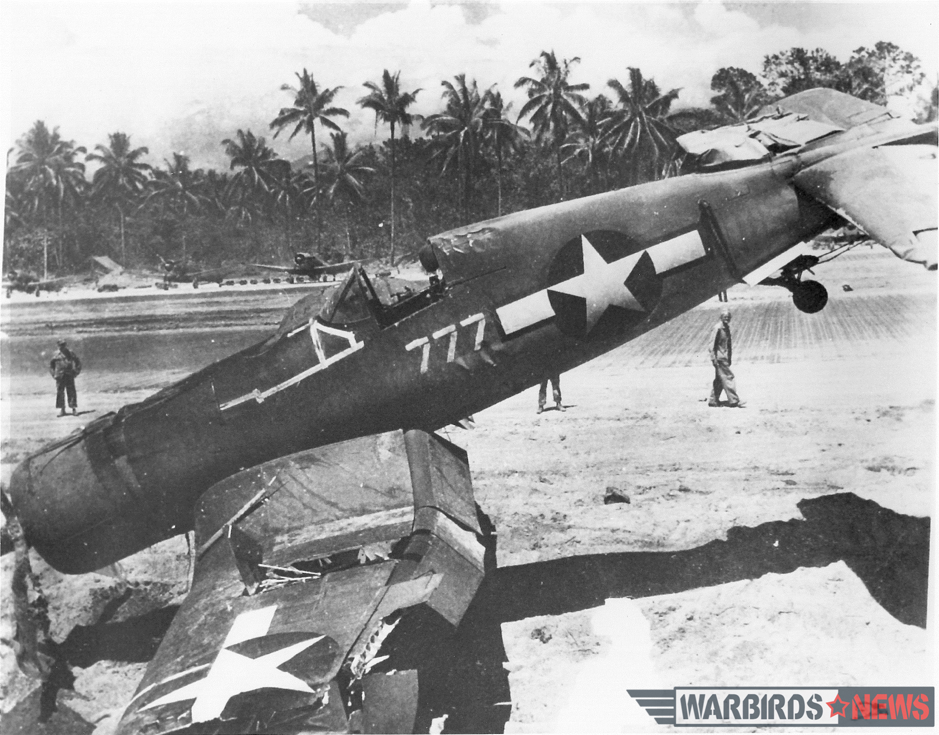 Even when conditions were ideal, putting the high-performance Corsair down on a narrow runway of pierced steel planking could lead to trouble. If a pilot strayed off the edge of the paved runway and hooked a wheel in the soft shoulder, the result was often a sudden flip upside down. Black Sheep pilot Denmark Groover had the distinction of overturning two Corsairs—but he walked away from both accidents, including this one in “lucky” side number 777. Photo credit: Bruce Gamble collection via National Archives
